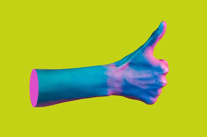 Custom magazine printing showing a green background with a blue and pink man's arm giving a thumbs up