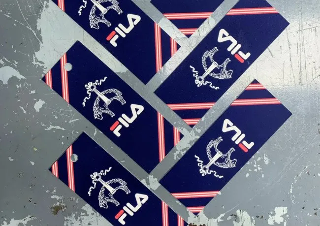 Blue and red Wild poster with FILA logos
