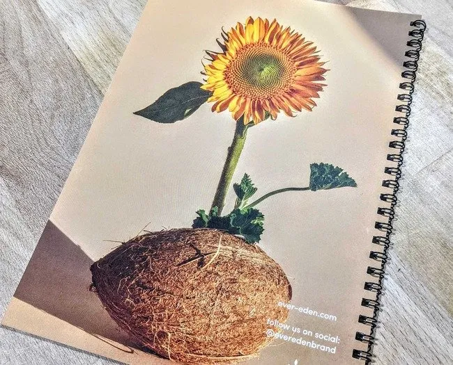 Small spiral bound book with sunflower on the cover