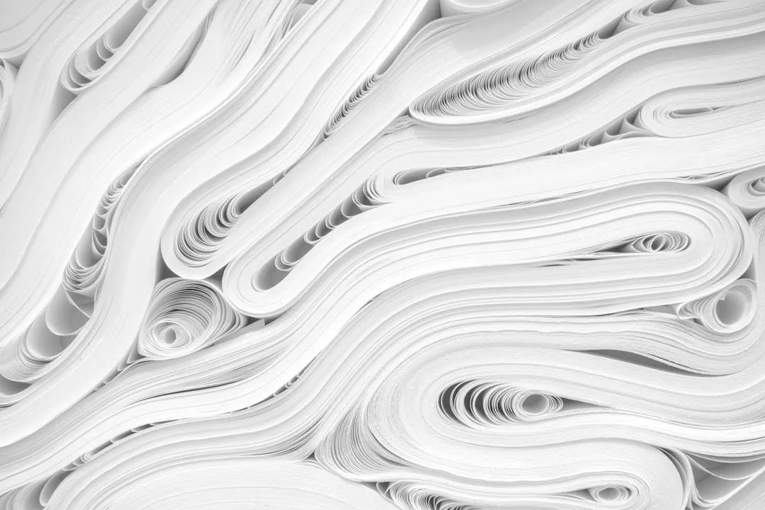 Multiple stacks of paper of varying paper thickness are mixed and rolled together.